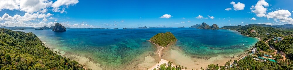 Fototapeta na wymiar Drone panorama of the paradisiacal Maremegmeg beach near El Nido on the Philippine island of Palawan during the day