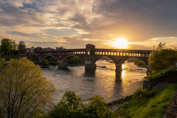 Fototapeta na wymiar Ponte Coperto (covered bridge) over Ticino river in Pavia at sunny, Lombardy, italy.