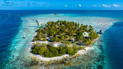 Aerial of a little island at the Avatoru Pass, Rangiroa atoll, Tuamotus, French Polynesia, South Pacific