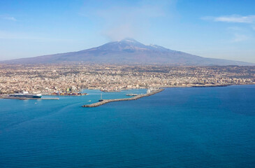 View of Etna volcano and Catania in Sicily