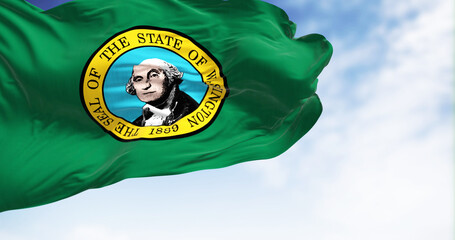 The flag state of Washington waving in the wind on a clear day