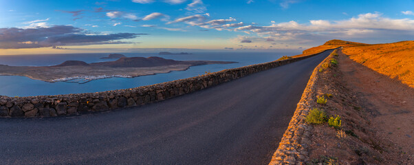 View of road and La Graciosa Island from Mirador del Rio at sunset, Lanzarote, Las Palmas