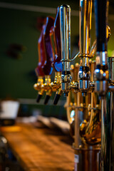 Fototapeta na wymiar beer taps in bar or pub