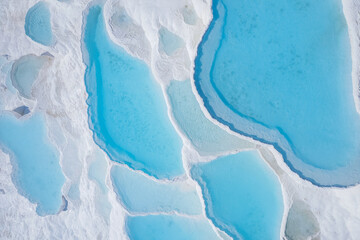 Aerial top view Pamukkale Turkey travertine pools, nature terraces with blue water - obrazy, fototapety, plakaty