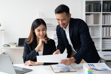 Young professional business people working together with their new company project in the modern office room.