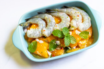 Marian plum Thai style spicy salad with pickled shrimp.