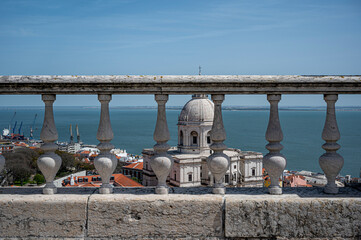 View of stone stairs, railing, balusters and Church of Santa Engracia National Pantheon in Lisbon,...