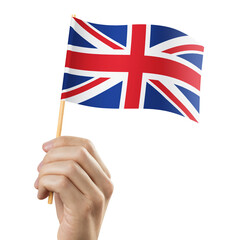 Hand holding flag of UK, cut out