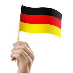 Hand holding flag of Germany, cut out