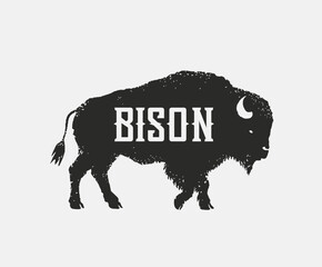 Symbol of the silhouette of a bison (bull), in the form of standing on his feet and looking forward. Vector illustration. © Rustic