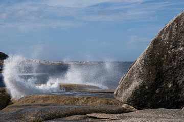Blowhole at Bicheno beach erupting water in Tasmania, Australia
