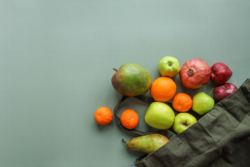 Eco bag with products on color background