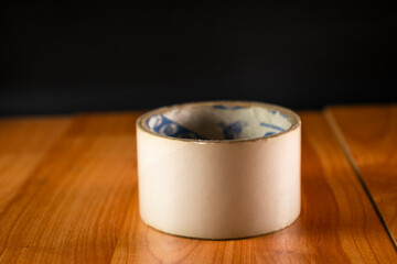 Masking tape on wooden background 