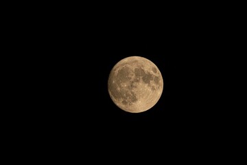 Full moon in the dark sky