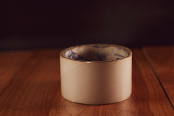 Masking tape on wooden background 