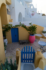 blue wooden gate against volcano caldera, beautiful details of Santorini island, Greece