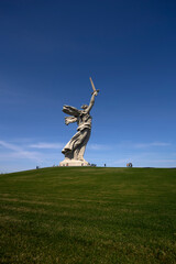 The Motherland Calls monument in Mamayev Hill War Memorial at sunset in Volgograd city, Russia. Clear blue sky. It is the tallest statue in Europe. Russian culture theme.