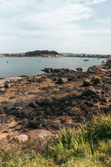Rocky shore with small fishing boats