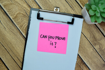 Concept of Can You Prove it? write on sticky notes isolated on Wooden Table. - obrazy, fototapety, plakaty