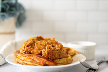 chicken and waffles on a plate with flower background