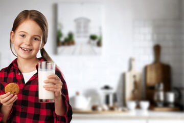 Cute child drinking milk smiling happily