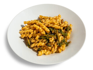 Fusilli pasta with turnip tops, typical Italian recipe from Puglia, in white plate isolated