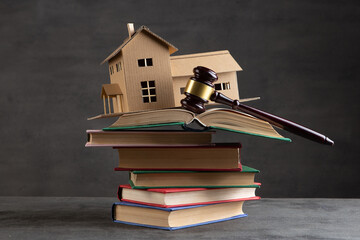 House model, gavel and books on the desk, Real property law concept, real estate auction