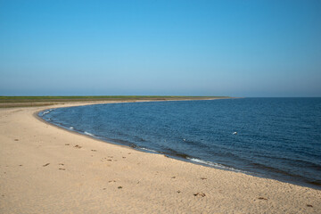 Beach landscape with road bridge through North Sea in the Netherlands, near Enkhuizen amd Lelystad
