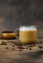 Tasty cup of cappuccino cappuccino in glasse in dark background.