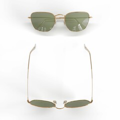 Pair of class beautiful sunglasses with gold rims isolated on a white background