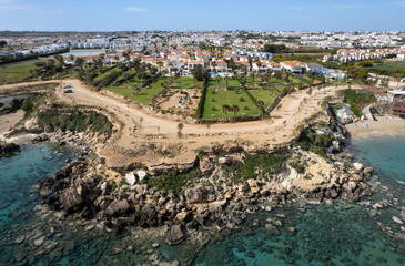 Fototapeta na wymiar Drone aerial of holiday village with luxury houses at an idyllic rocky coast. Summer vacations at the sea. Protaras Cyprus