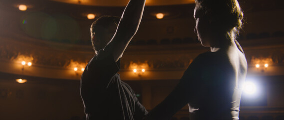 Close up shot of ballet dancers practicing and rehearsing choreography on classic theater stage...