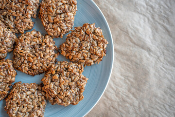 Vegan cookies made of banana and different seeds, photographed with natural light