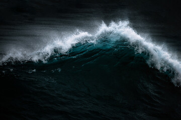 Close up of a Splashing wave on the Algarve Coast in Portugal during a stormy day.