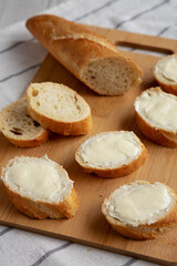 Homemade Bread and Butter on a bamboo board, side view.