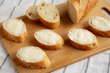 Homemade Bread and Butter on a bamboo board, side view.