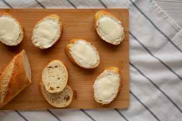 Homemade Bread and Butter on a bamboo board, top view. Flat lay, overhead, from above.