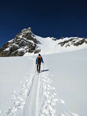 Fototapeta na wymiar Ski touring trail on the glacier. Exceeding the Clariden firn. High ski tour in uri switzerland. Skimo. High quality photo