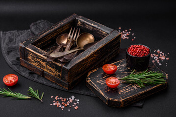 Vintage rectangular shabby wooden box with spoons and forks