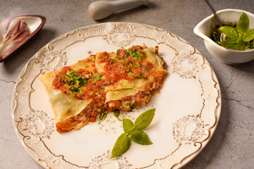 Crepes filled with steak, mushrooms, and vegetables