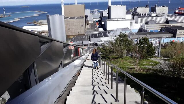 Copenhagen, Denmark A person walks down the steps of the Copen Hill power plant that doubles as a ski slope. 