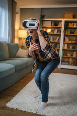 Woman mature senior female at home enjoy virtual reality VR headset