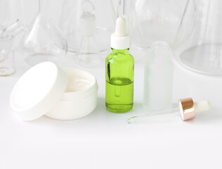 skin serum, moisturizing and whitening serum, fruit acids.Glass Volumetric Flask  ,Laboratory Flasksare used for  laboratory work  in the background