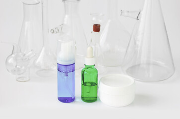 skin serum, moisturizing and whitening serum, fruit acids.Glass Volumetric Flask  ,Laboratory Flasksare used for  laboratory work  in the background