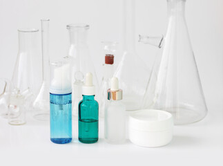 skin serum, moisturizing and whitening serum, fruit acids.Glass Volumetric Flask  ,Laboratory Flasksare used for  laboratory work  in the background