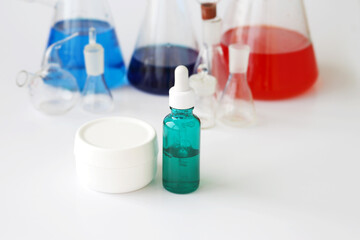 skin serum, moisturizing and whitening serum, fruit acids.Glass Volumetric Flask  ,Laboratory Flasksare used for  laboratory work  in the background