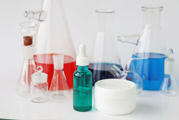 skin serum, moisturizing and whitening serum, fruit acids.Glass Volumetric Flask  ,Laboratory Flasksare used for  laboratory work  in the background