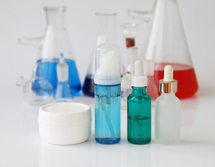 skin serum, moisturizing and whitening serum, fruit acids.Glass Volumetric Flask  ,Laboratory Flasksare used for  laboratory work  in the background