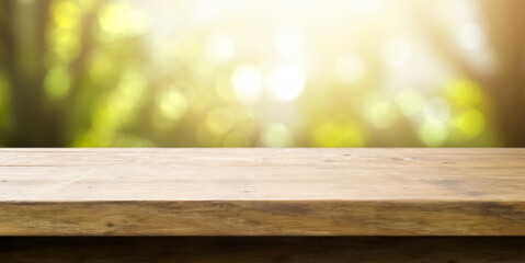 empty wooden table with a spring green background - copy space