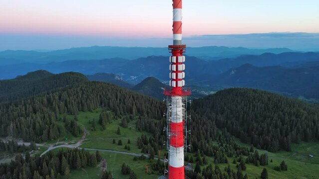 Tower Snezhana on peak of Snezhana covered with spruce forests in Rhodope mountains